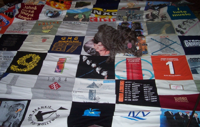 Turned all my concert T-shirts into a quilt (no, I did not make it)