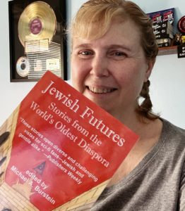 Author holding up book "Jewish Futures"